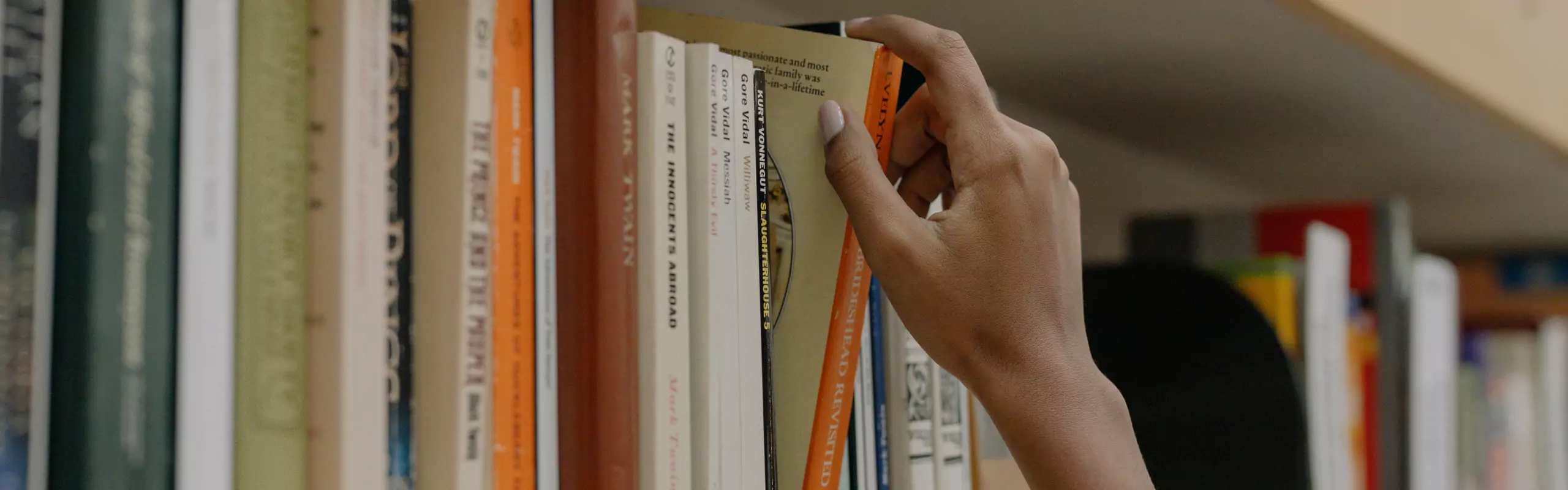 Taking a book from shelf
